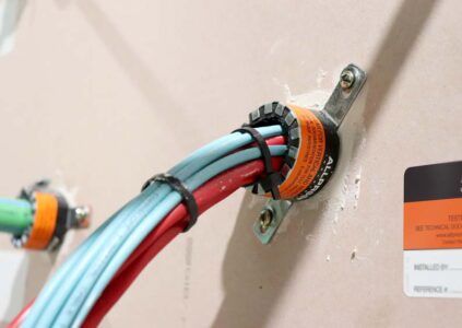 Data Cable Bundle fire collar low profile plasterboard wall with data cables install
