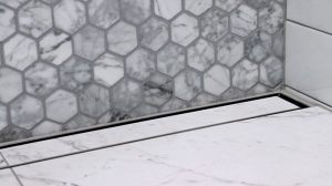 Tile-over-stainless-steel-shower-tray-base-wth-linear-channel-strip-drain-tile-insert-grate-close-finished